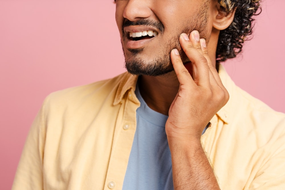 Young,Man,In,Pain,From,A,Toothache,,Touching,His,Jaw 1760462904 ff6622a7d4764990993041518f922780 1